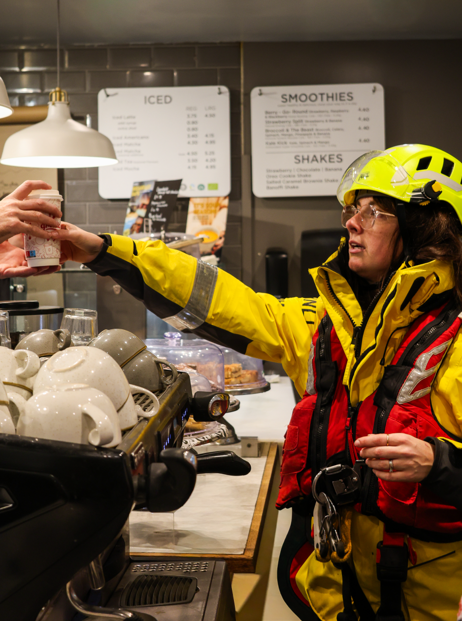 Serving coffee in RNLI yellows